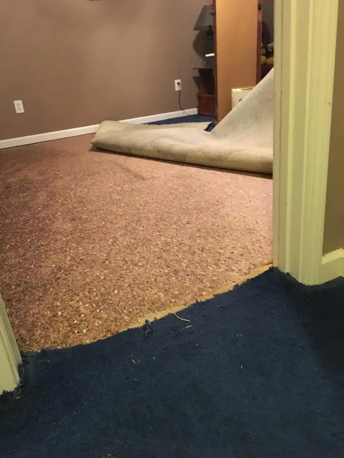 Carpet pad removal revealing water damage during Drying & Dehumidification in Memphis
